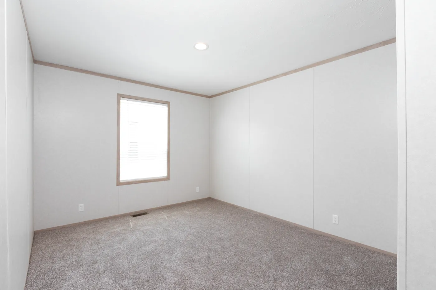 The 6032-5700 THE PULSE Guest Bedroom. This Manufactured Mobile Home features 3 bedrooms and 2 baths.