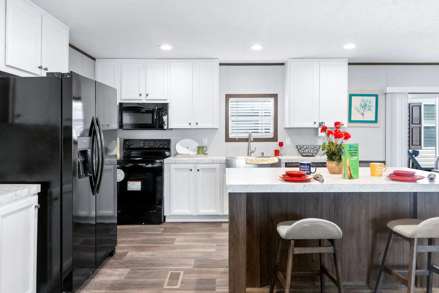 The THE SUNDOWNER Kitchen. This Manufactured Mobile Home features 3 bedrooms and 2 baths.