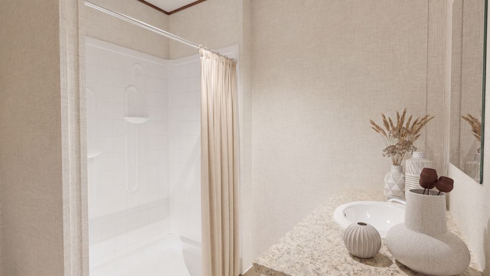 The SYCAMORE Primary Bathroom. This Manufactured Mobile Home features 4 bedrooms and 2 baths.
