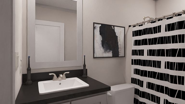 The JOHNNY B GOODE Guest Bathroom. This Manufactured Mobile Home features 3 bedrooms and 2 baths.