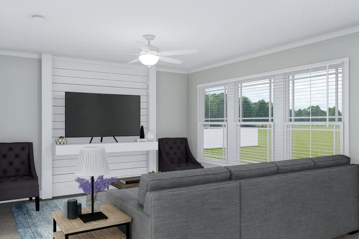 The THE BREEZE Living Room. This Manufactured Mobile Home features 3 bedrooms and 2 baths.