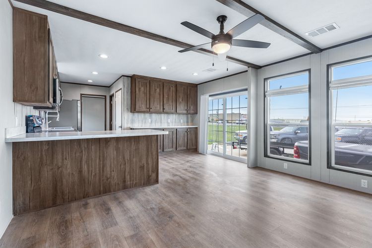 The ANNIVERSARY 16683B Living Room. This Manufactured Mobile Home features 3 bedrooms and 2 baths.