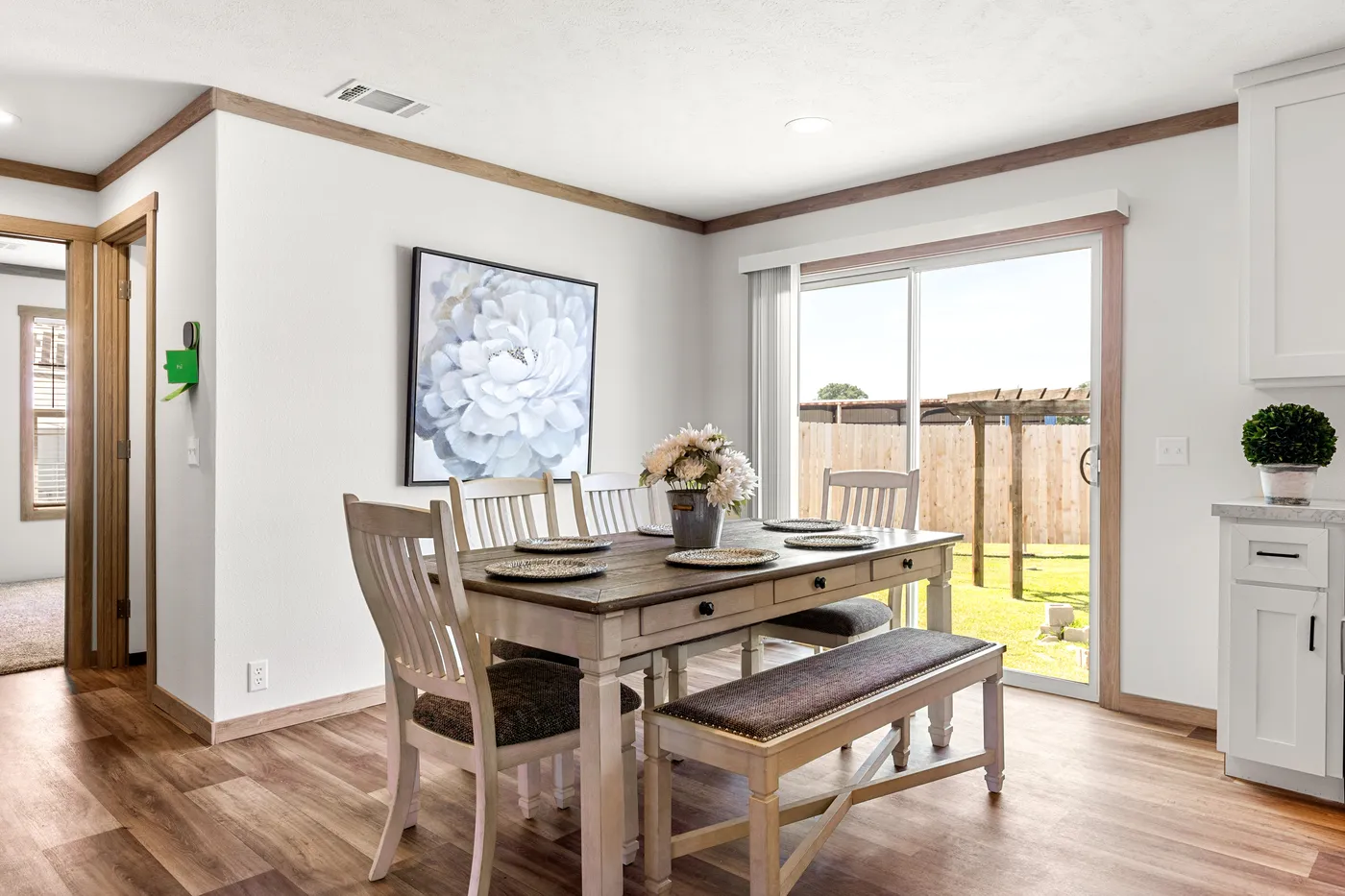 The LIZZIE Dining Area. This Manufactured Mobile Home features 3 bedrooms and 2 baths.