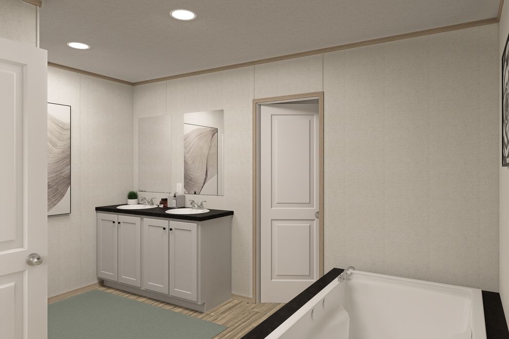The THE EAGLE 76 Primary Bathroom. This Manufactured Mobile Home features 5 bedrooms and 2 baths.