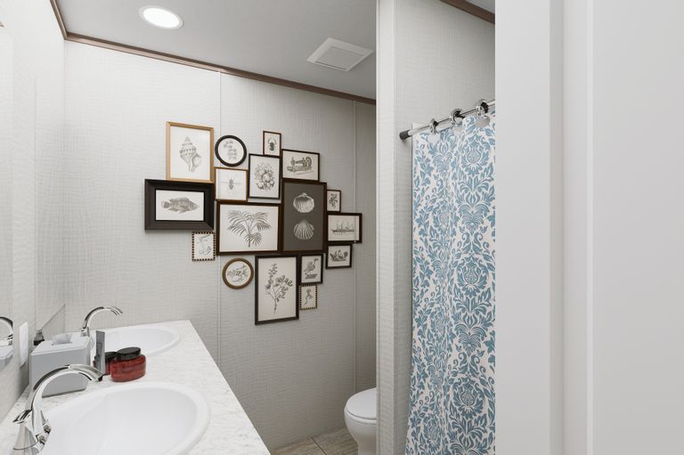 The ULTRA FLEX 76 Guest Bathroom. This Manufactured Mobile Home features 4 bedrooms and 2 baths.
