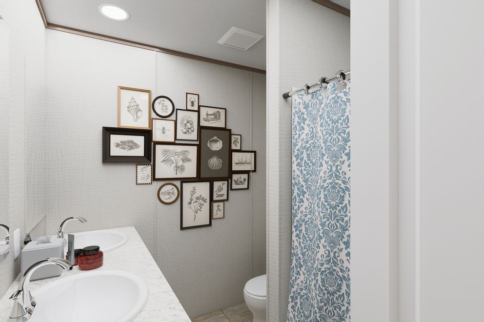 The ULTRA FLEX 76 Guest Bathroom. This Manufactured Mobile Home features 4 bedrooms and 2 baths.