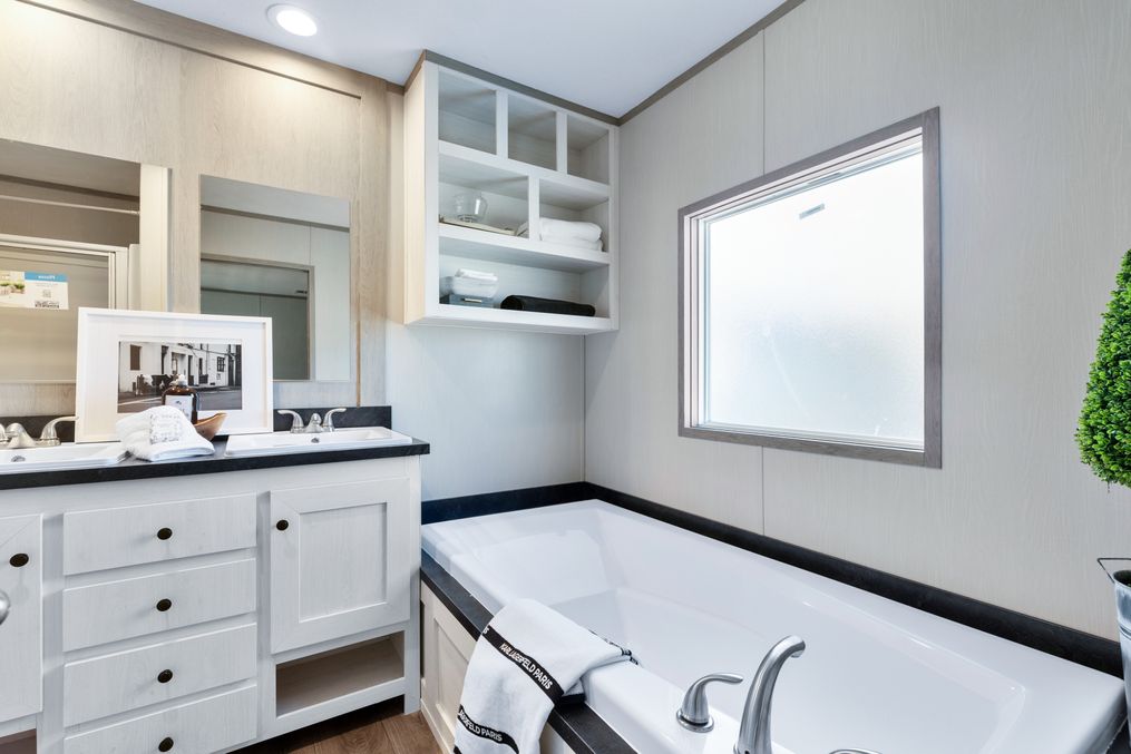 The PORCH LIVING SERIES 16682A Guest Bathroom. This Manufactured Mobile Home features 2 bedrooms and 2 baths.