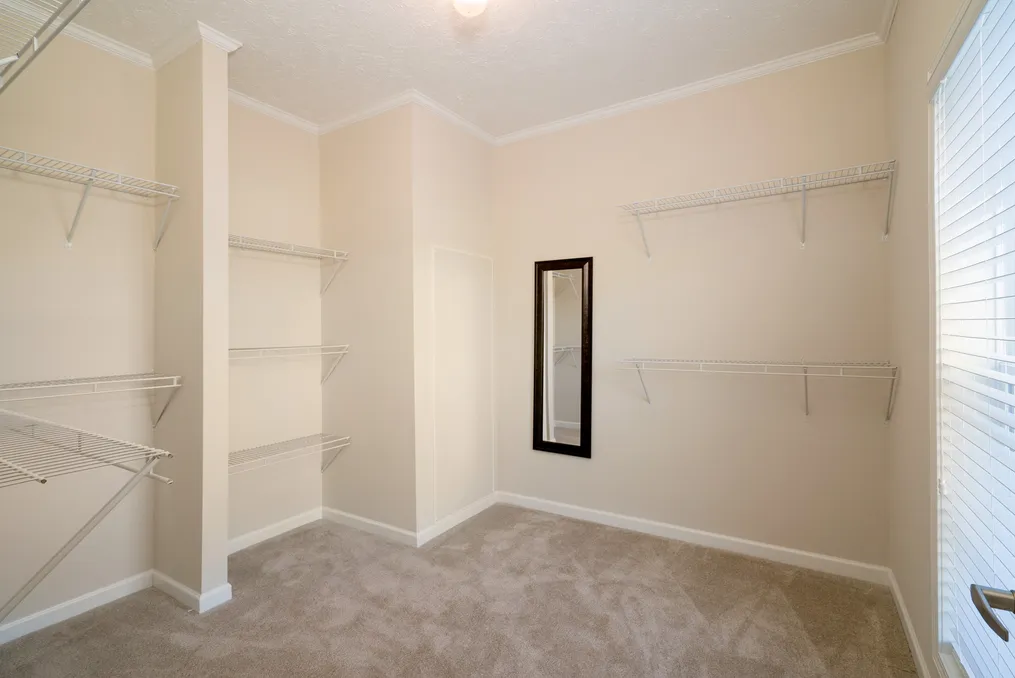 The 1545 JAMESTOWN Primary Bedroom closet. This Manufactured Home features 3 bedrooms and 2 baths.