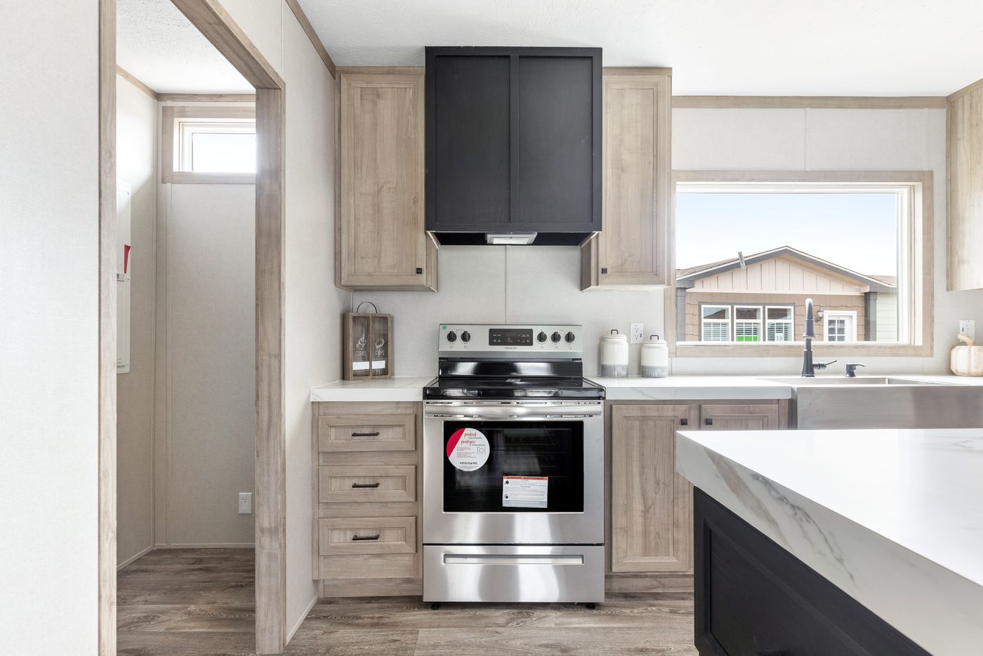 The STERLING XL ANNIVERSARY Kitchen. This Manufactured Mobile Home features 3 bedrooms and 2 baths.
