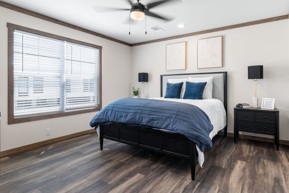 The FARM 4 FLEX Primary Bedroom. This Manufactured Mobile Home features 4 bedrooms and 3 baths.