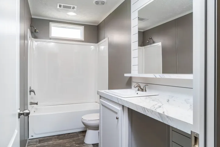 The LOCKLEAR Exterior. This Manufactured Mobile Home features 4 bedrooms and 2 baths.
