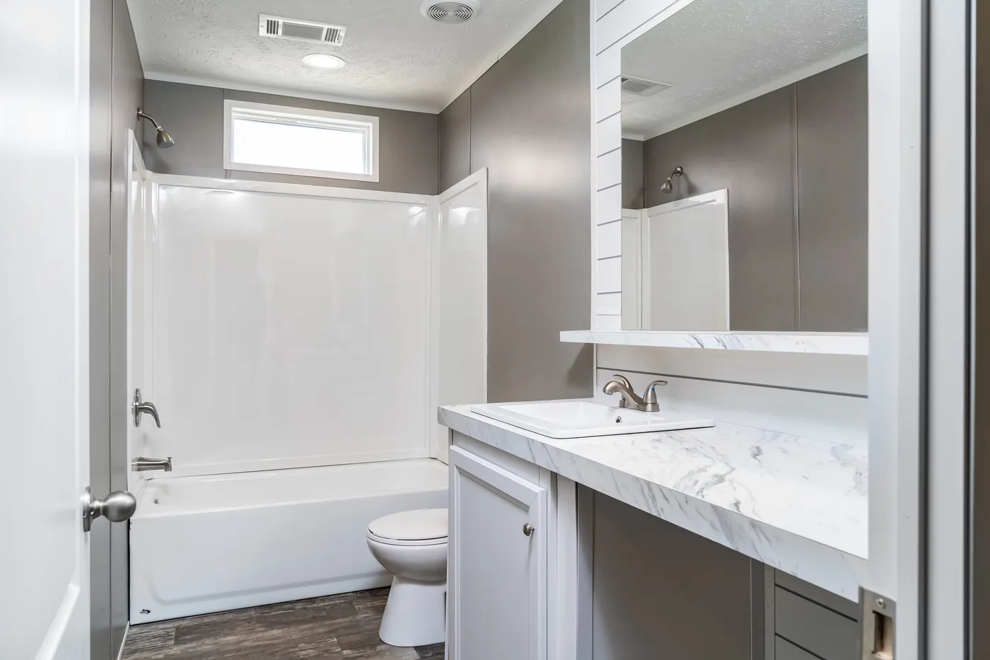 The LOCKLEAR Exterior. This Manufactured Mobile Home features 4 bedrooms and 2 baths.
