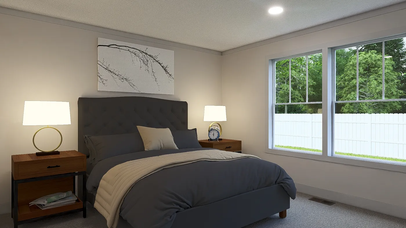 The STAYIN' ALIVE Primary Bedroom. This Manufactured Mobile Home features 3 bedrooms and 2 baths.