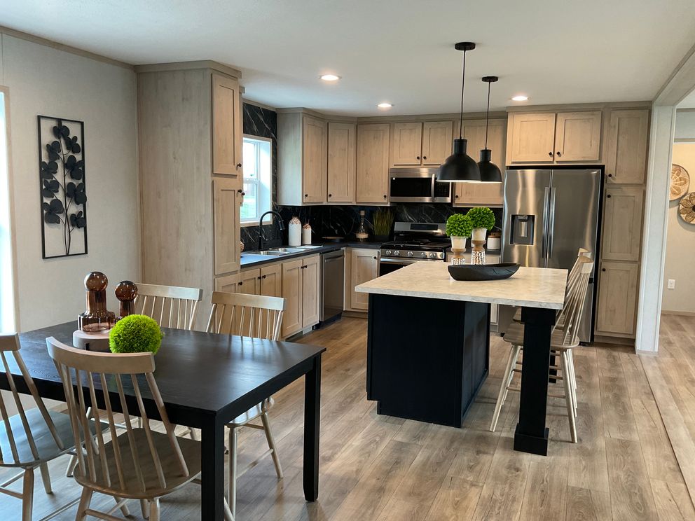 The EMERALD 7228-643 Dining Area. This Manufactured Mobile Home features 4 bedrooms and 2 baths.