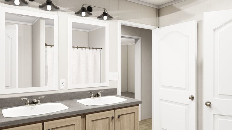 The THE RESERVE 76 Primary Bathroom. This Manufactured Mobile Home features 4 bedrooms and 2 baths.