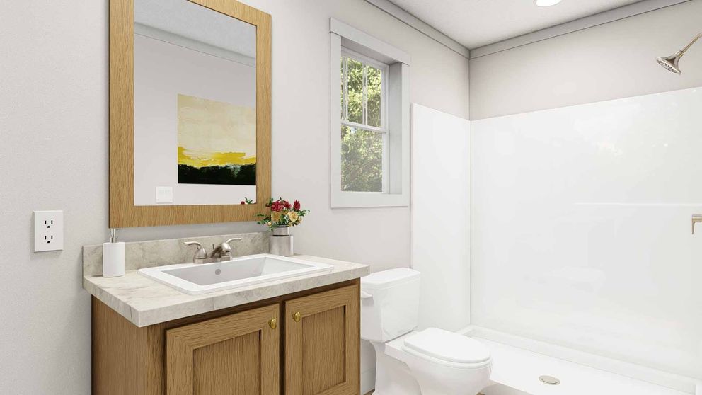 The MOVE ON UP Primary Bathroom. This Manufactured Mobile Home features 3 bedrooms and 2 baths.