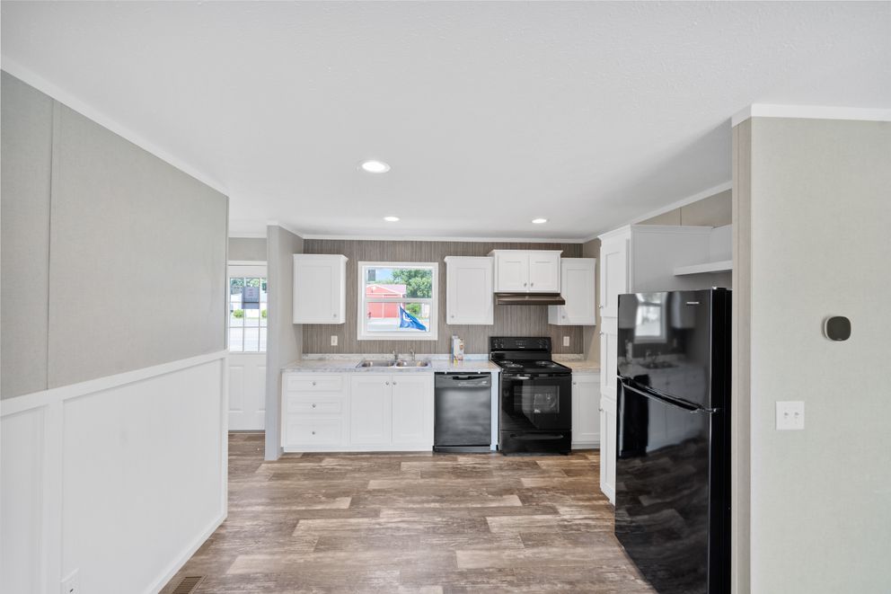 The ZIRCON Dining Area. This Manufactured Mobile Home features 3 bedrooms and 2 baths.