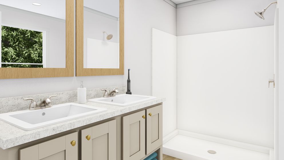 The HERE COMES THE SUN Primary Bathroom. This Manufactured Mobile Home features 3 bedrooms and 2 baths.
