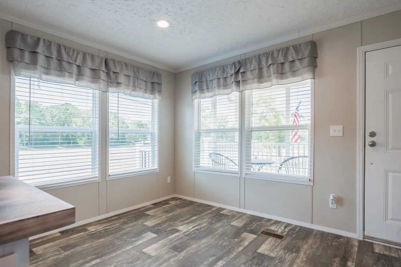 The NORTHSHORE Dining Room. This Manufactured Mobile Home features 3 bedrooms and 2 baths.