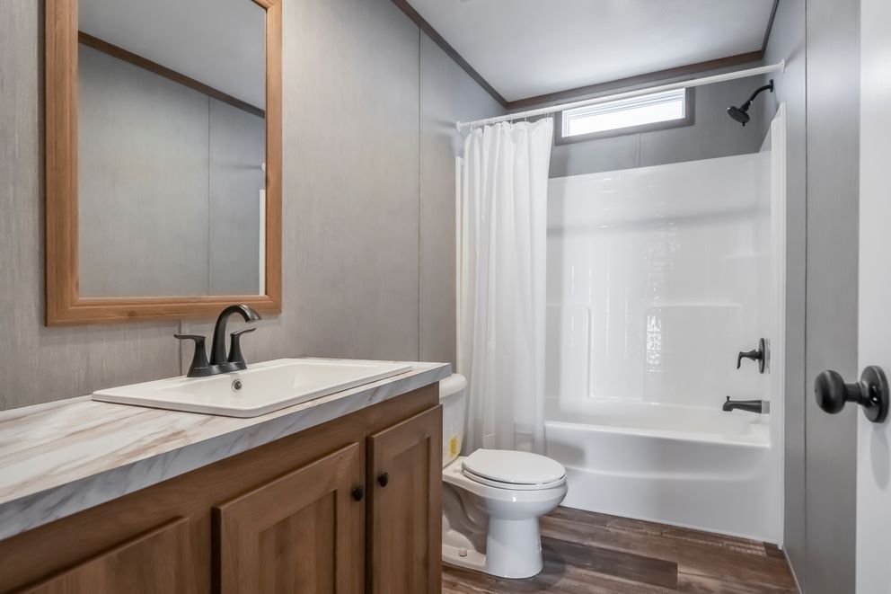The BLACK DIAMOND Guest Bathroom. This Manufactured Mobile Home features 3 bedrooms and 2 baths.