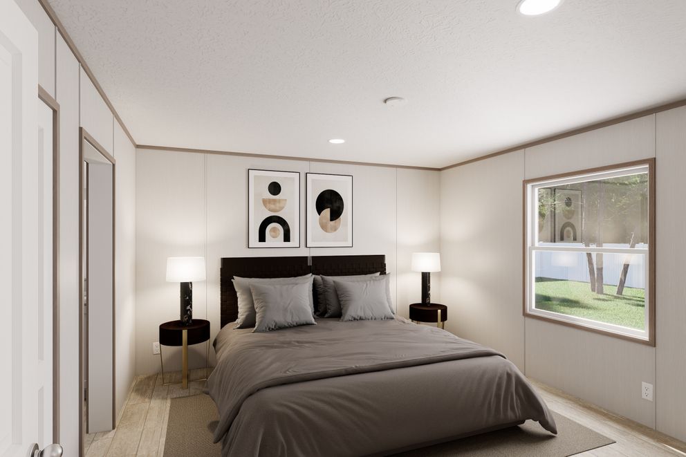 The ULTRA FLEX Primary Bedroom. This Manufactured Mobile Home features 3 bedrooms and 2 baths.