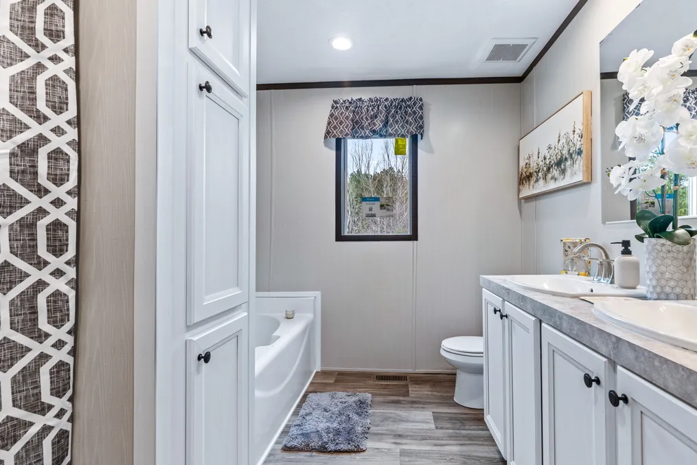 The THE GRAND Primary Bathroom. This Manufactured Mobile Home features 3 bedrooms and 2 baths.