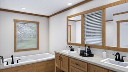 The LAYLA Primary Bathroom. This Manufactured Mobile Home features 4 bedrooms and 2 baths.