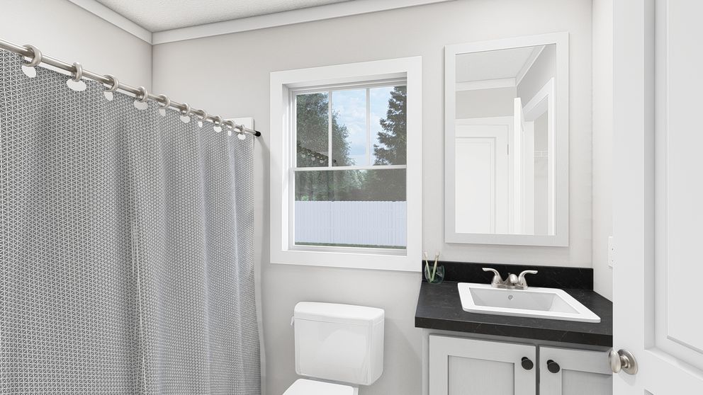The YESTERDAY Guest Bathroom. This Manufactured Mobile Home features 1 bedroom and 1 bath.