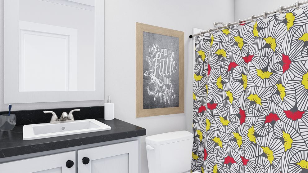 The STAYIN' ALIVE Guest Bathroom. This Manufactured Mobile Home features 3 bedrooms and 2 baths.