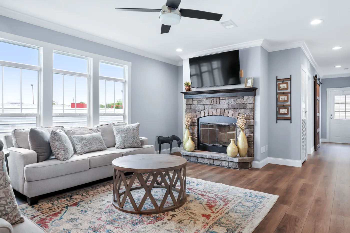 The THE ATLAS Living Room. This Manufactured Mobile Home features 4 bedrooms and 3 baths.