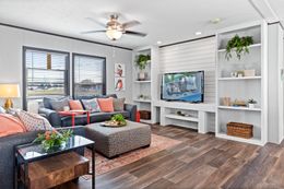 The THE REAL DEAL Living Room. This Manufactured Mobile Home features 3 bedrooms and 2 baths.