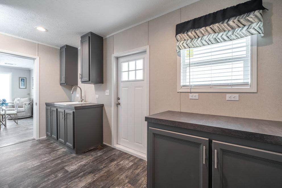 The ALL AMERICAN Utility Room. This Manufactured Mobile Home features 3 bedrooms and 2 baths.