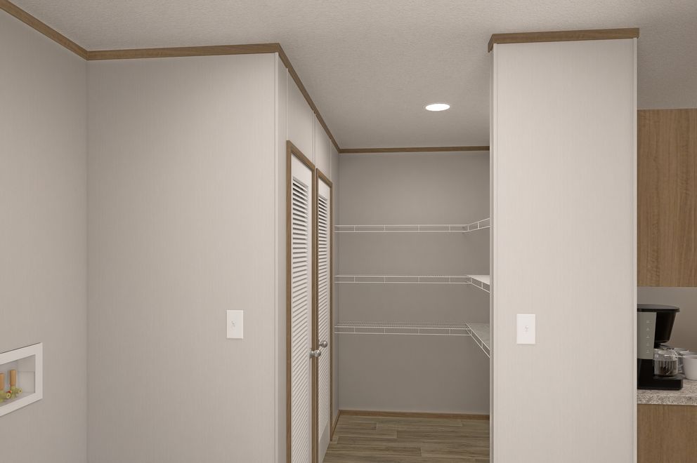 The THE EAGLE 60 Utility Room. This Manufactured Mobile Home features 3 bedrooms and 2 baths.