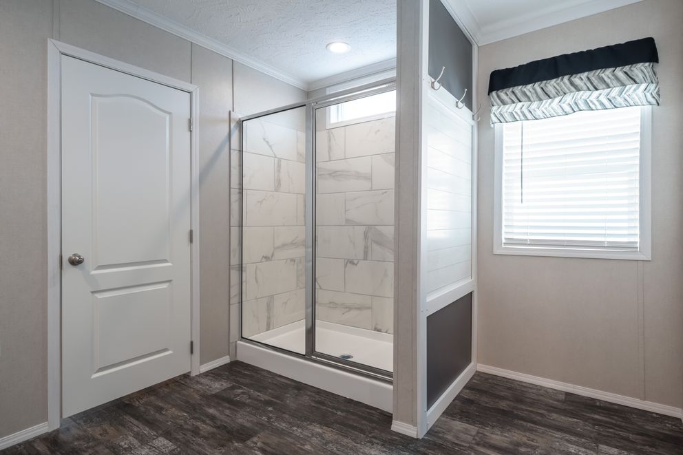 The ALL AMERICAN Primary Bathroom. This Manufactured Mobile Home features 3 bedrooms and 2 baths.