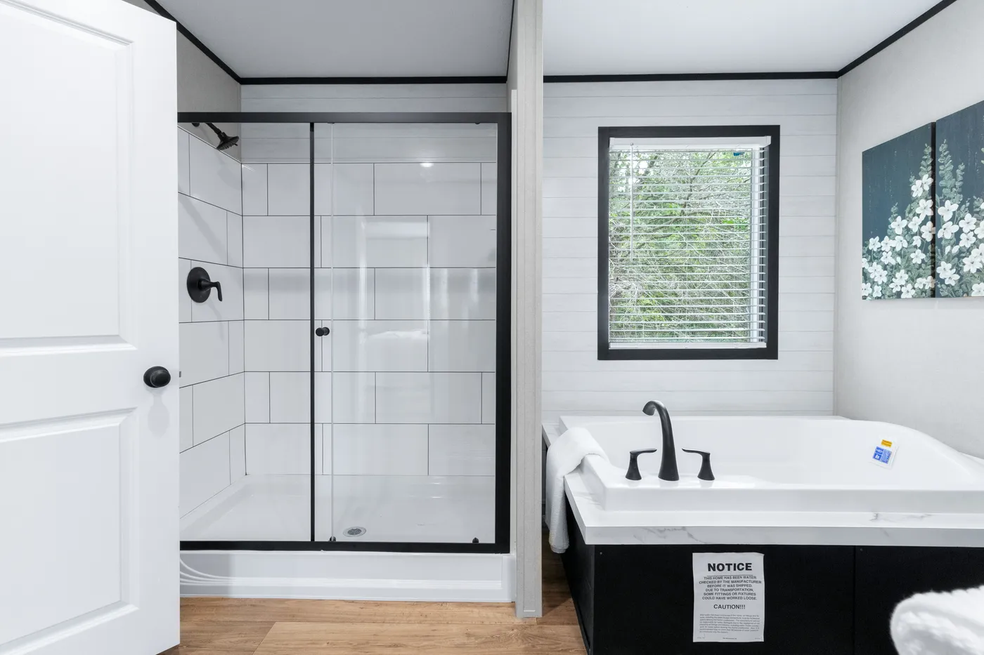 The ABSOLUTE VALUE Primary Bathroom. This Manufactured Mobile Home features 4 bedrooms and 2 baths.