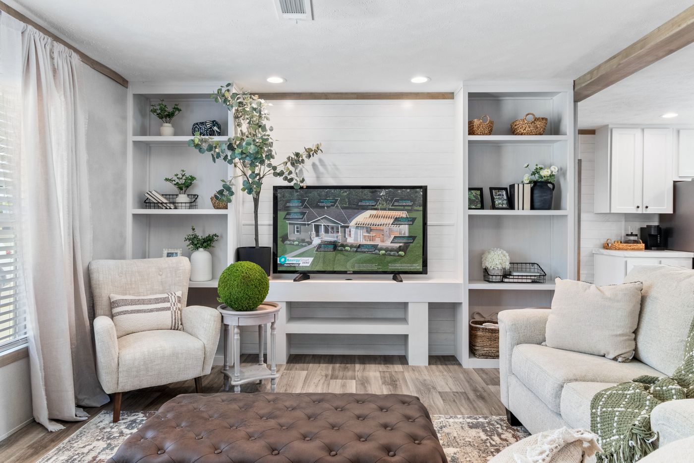 The THE REAL DEAL Living Room. This Manufactured Mobile Home features 3 bedrooms and 2 baths.