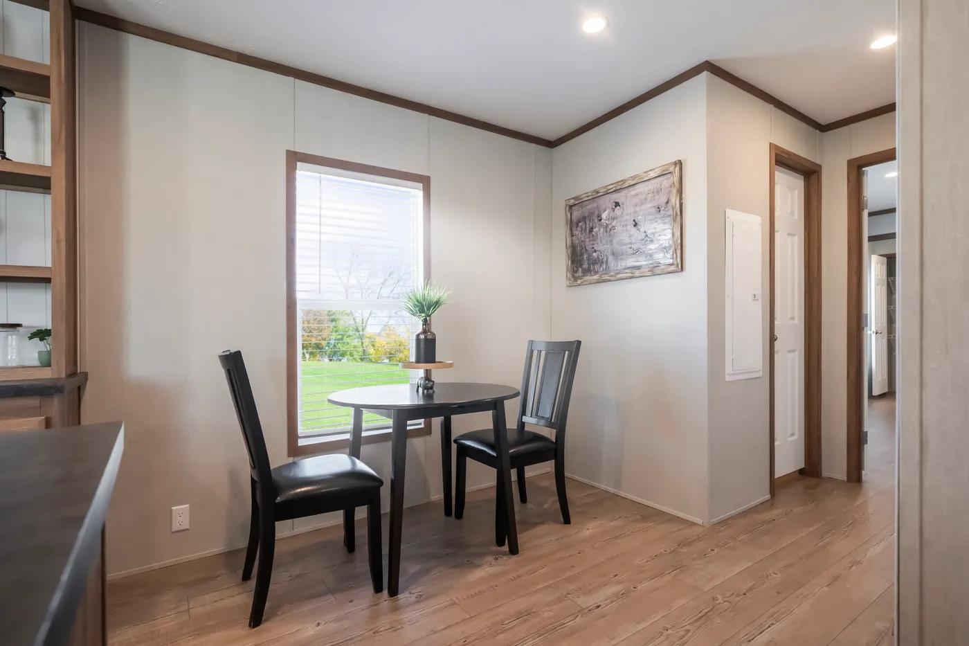 The SEAS THE DAY Dining Area. This Manufactured Mobile Home features 3 bedrooms and 2 baths.