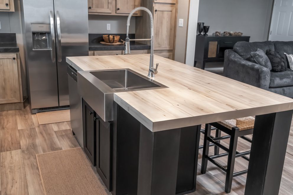 The TRADITION 72 Kitchen. This Manufactured Mobile Home features 3 bedrooms and 2 baths.