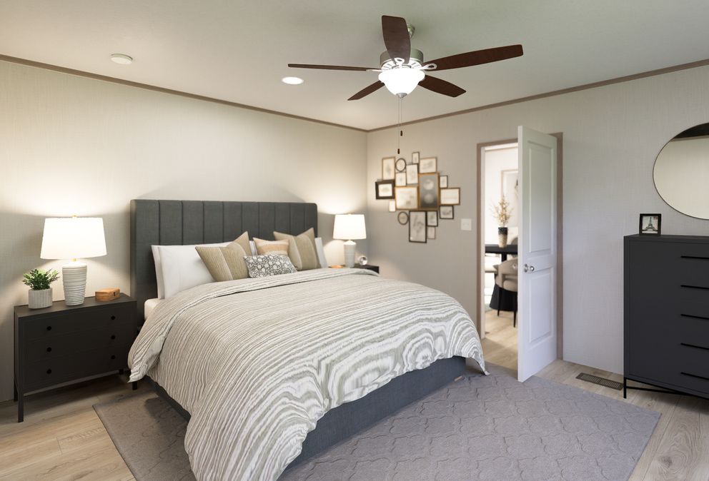 The ULTRA FLEX ANNIVERSARY PLUS Primary Bedroom. This Manufactured Mobile Home features 3 bedrooms and 2 baths.