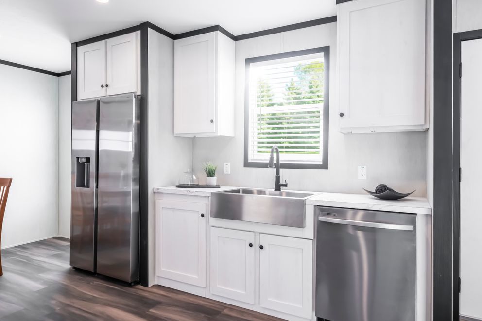 The LIL SOUTHERN CHARM Kitchen. This Manufactured Mobile Home features 3 bedrooms and 2 baths.