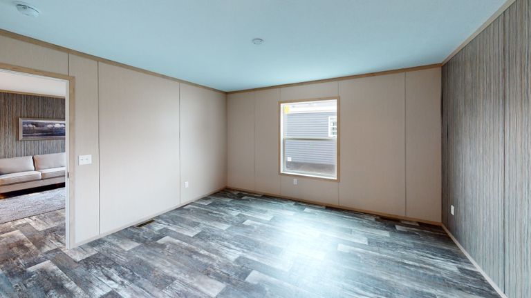 The HANCOCK Primary Bedroom. This Manufactured Mobile Home features 4 bedrooms and 2 baths.