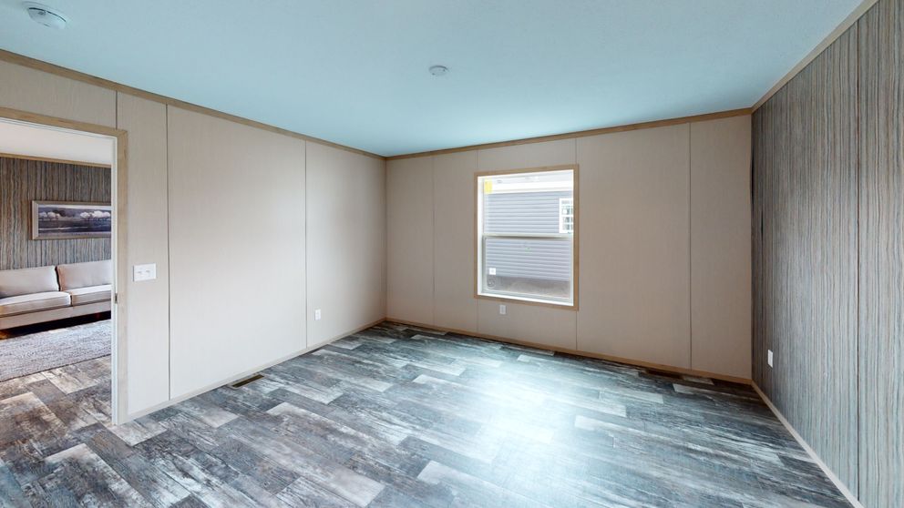 The HANCOCK Primary Bedroom. This Manufactured Mobile Home features 4 bedrooms and 2 baths.