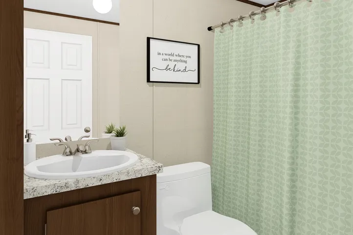 The DELIGHT Guest Bathroom. This Manufactured Mobile Home features 2 bedrooms and 2 baths.
