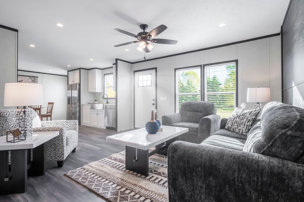 The LIL SOUTHERN CHARM Living Room. This Manufactured Mobile Home features 3 bedrooms and 2 baths.