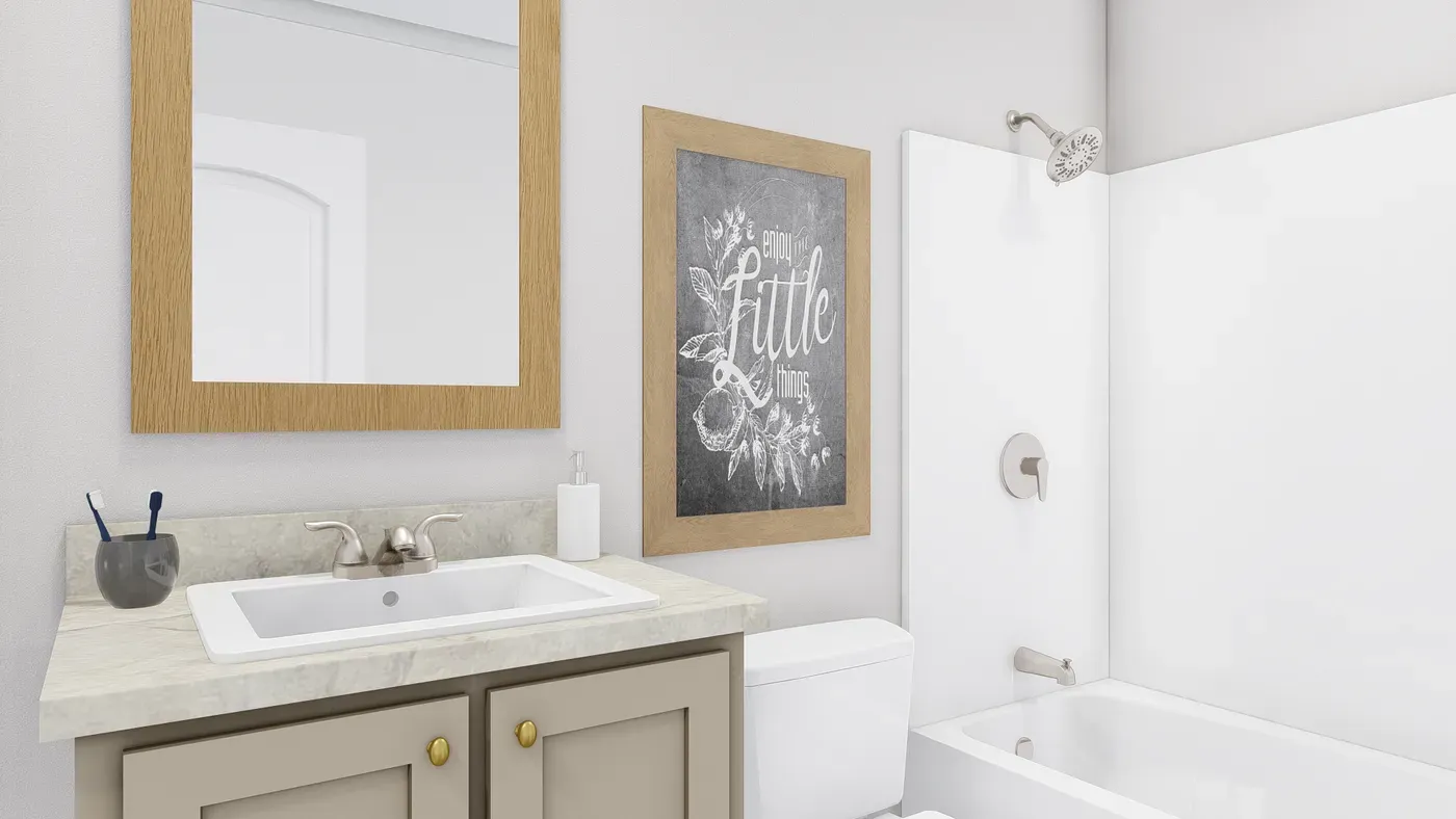 The STAYIN' ALIVE Guest Bathroom. This Manufactured Mobile Home features 3 bedrooms and 2 baths.