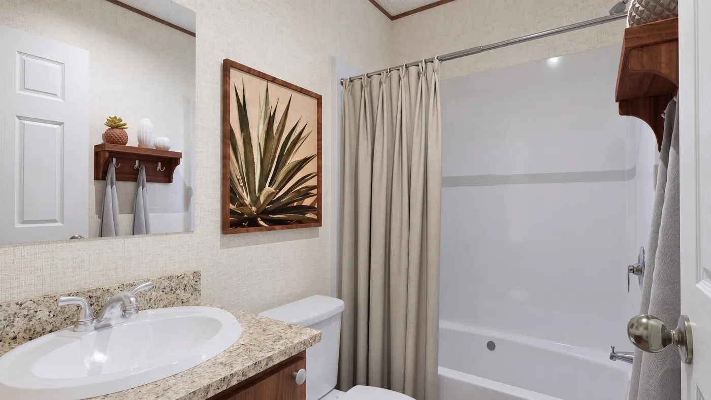 The DOGWOOD Guest Bathroom. This Manufactured Mobile Home features 2 bedrooms and 2 baths.