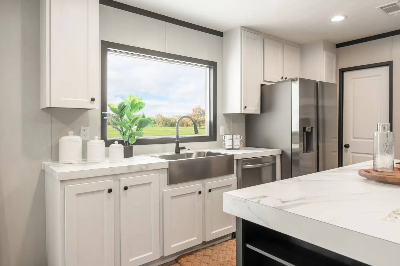 The THE ANNIVERSARY 2.1 Kitchen. This Manufactured Mobile Home features 3 bedrooms and 2 baths.