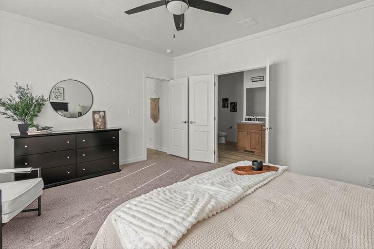 The TU3076A MEGA TUNDRA Primary Bedroom. This Manufactured Mobile Home features 4 bedrooms and 2 baths.