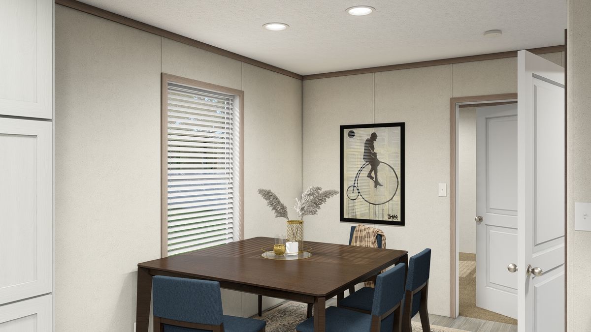 The 7616-4714 THE PULSE Dining Area. This Manufactured Mobile Home features 3 bedrooms and 2 baths.