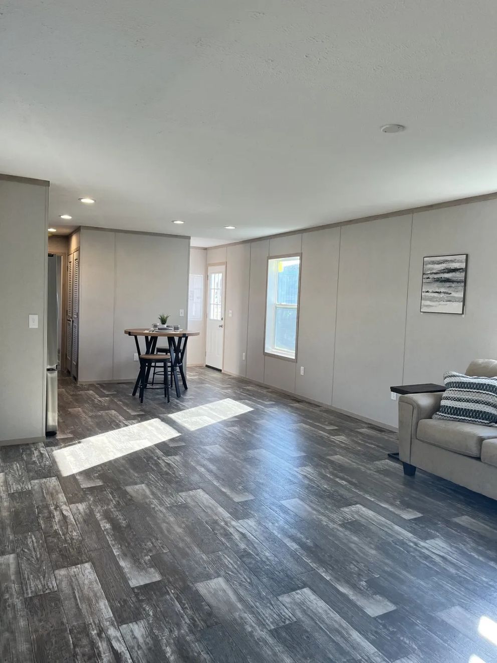 The SAPPHIRE Living Room. This Manufactured Mobile Home features 3 bedrooms and 2 baths.